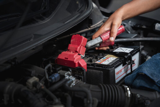 Mechanic fitting new car battery terminal - Expert battery fitting and replacement in Nottingham