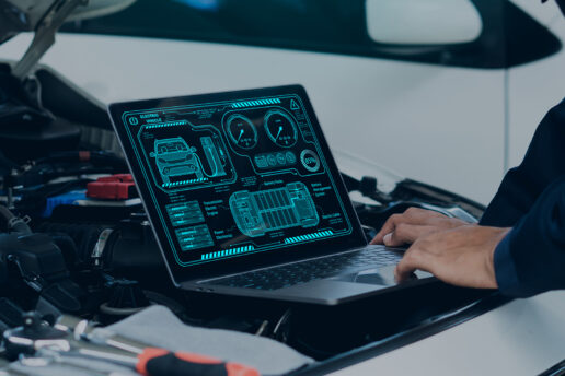 Vehicle Diagnostics Technician performing car diagnostics in Nottingham using advanced ECU diagnostic tools on a laptop.